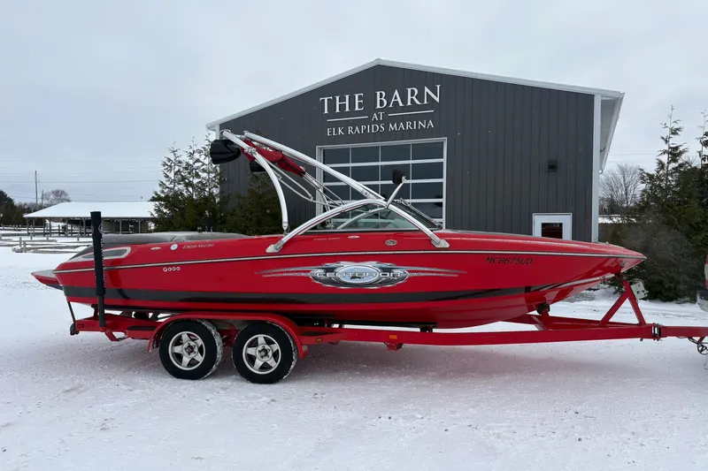 The Image of 2006 Centurion Enzo SV230 boat on trailer at Elk Rapids Marina in winter. - 1