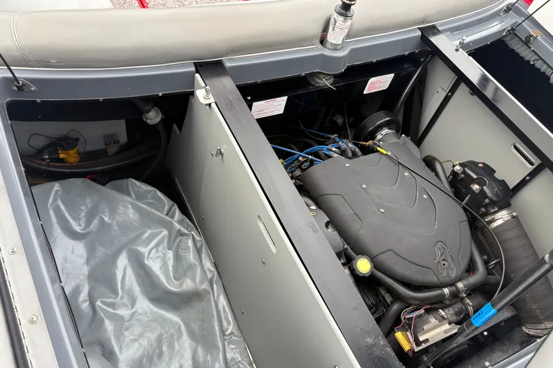 Slide: The Image of 2006 Centurion Enzo SV230 engine compartment with visible components and storage area. - 15