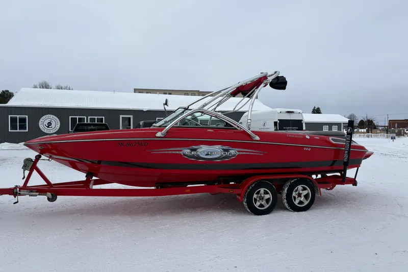 Slide: The Image of 2006 Centurion Enzo SV230 red boat on trailer in snowy setting. - 3