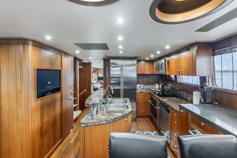 Slide: The Image of Luxurious kitchen interior of 2012 Cheoy Lee 84 Bravo yacht with modern appliances and wood finishes. - 14