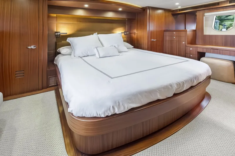 Slide: The Image of Luxurious bedroom interior of 2012 Cheoy Lee 84 Bravo yacht with elegant wood paneling. - 23