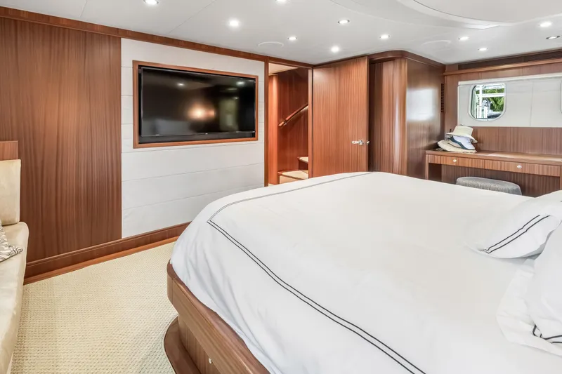 Slide: The Image of Luxurious bedroom interior of 2012 Cheoy Lee 84 Bravo yacht with elegant wood finishes. - 31