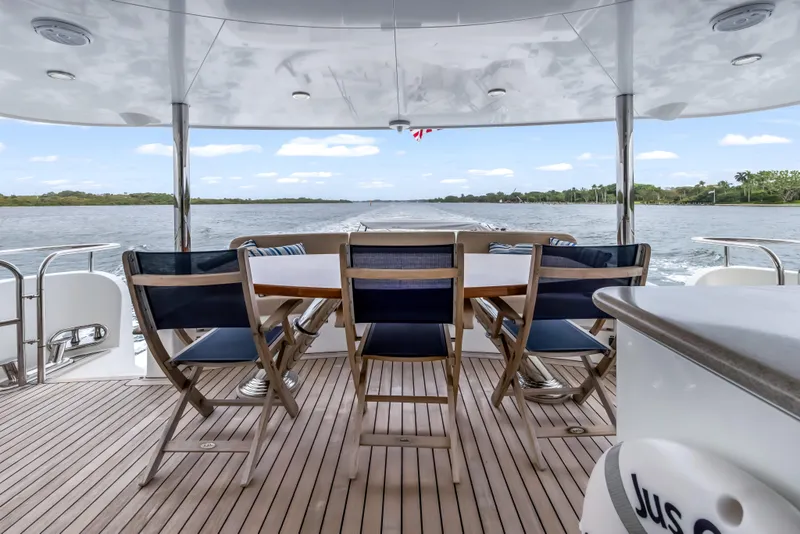 Slide: The Image of Luxurious deck of 2012 Cheoy Lee 84 Bravo yacht with seating and dining area. - 6