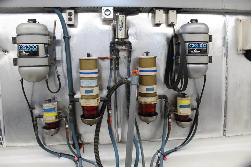 Slide: The Image of Engine room of 2003 Ocean Yachts 65 Odyssey with coolant recovery systems. - 106