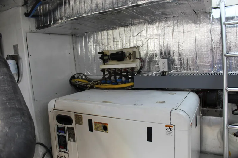 Slide: The Image of Engine room of 2003 Ocean Yachts 65 Odyssey with generator and equipment. - 112