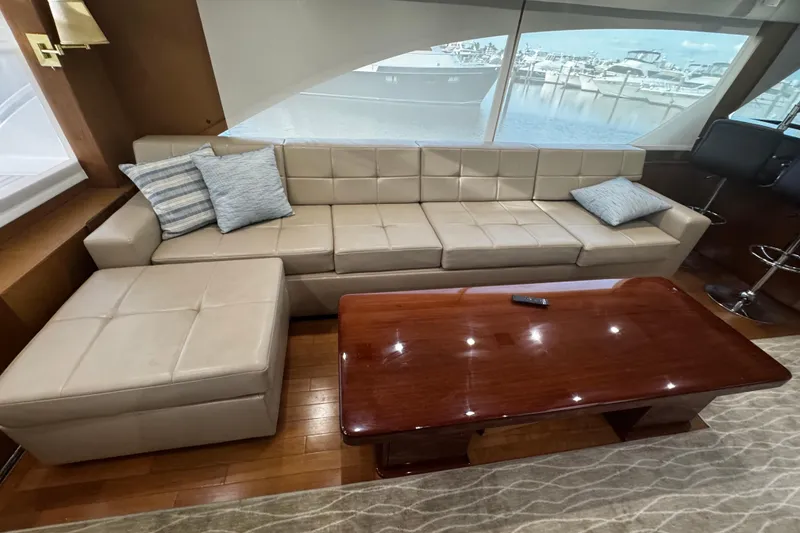 Slide: The Image of 2003 Ocean Yachts 65 Odyssey yacht deck with marina view under cloudy sky. - 24