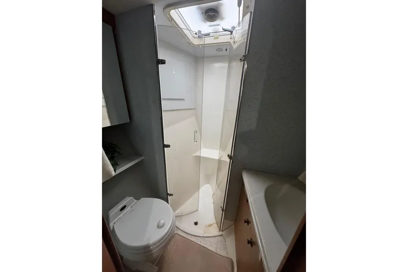 Slide: The Image of Luxurious interior of 2003 Ocean Yachts 65 Odyssey with plush seating and elegant wood finishes. - 34