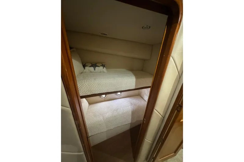 Slide: The Image of Interior of 2003 Ocean Yachts 65 Odyssey with spiral staircase and modern seating. - 36