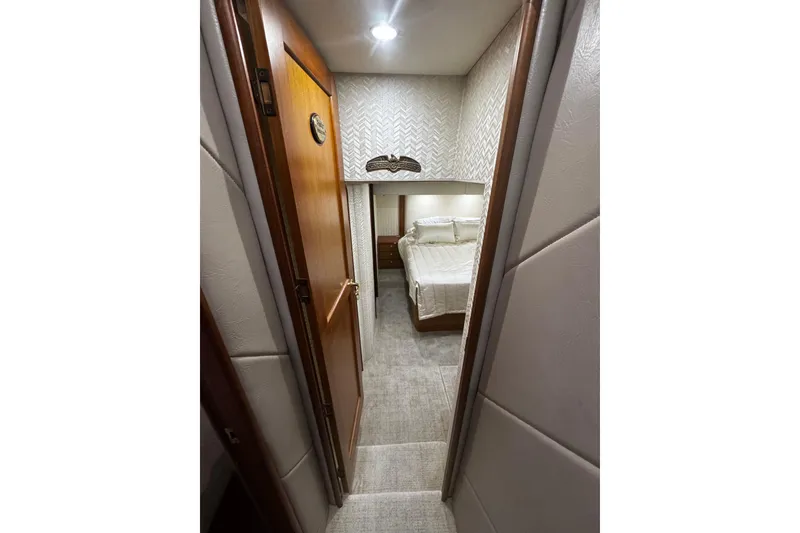Slide: The Image of Luxurious interior of 2003 Ocean Yachts 65 Odyssey with modern kitchen and seating area. - 37