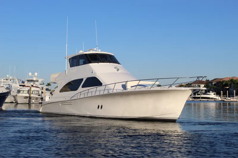 Slide: The Image of 2003 Ocean Yachts 65 Odyssey cruising in a marina under clear blue skies. - 4