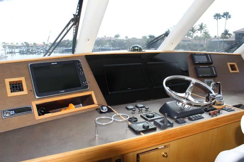 Slide: The Image of Helm of 2003 Ocean Yachts 65 Odyssey with navigation equipment and steering wheel. - 45