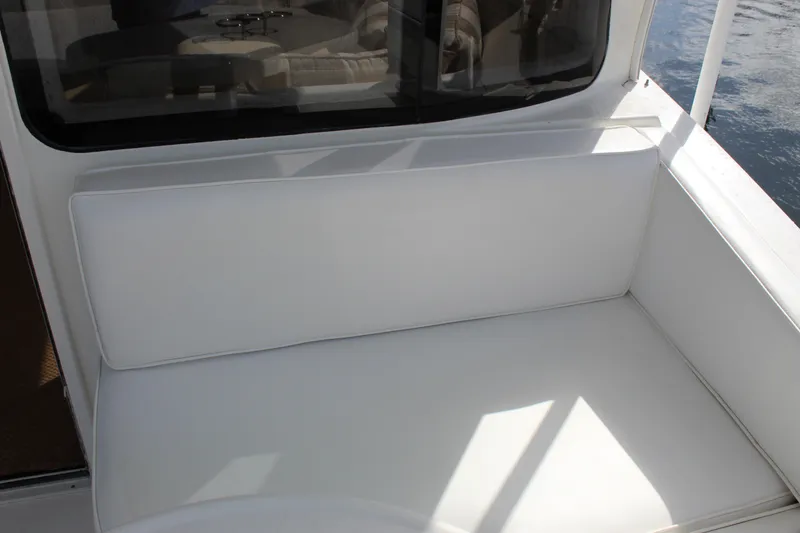 Slide: The Image of White seating area on 2003 Ocean Yachts 65 Odyssey boat deck. - 59