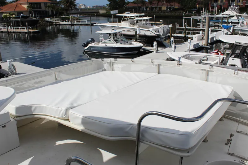 Slide: The Image of Luxurious 2003 Ocean Yachts 65 Odyssey with spacious sun deck in marina setting. - 60
