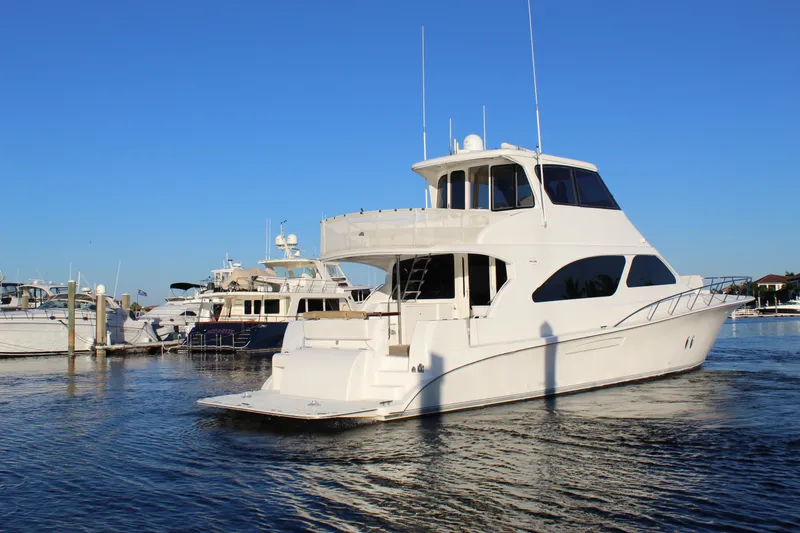 Slide: The Image of 2003 Ocean Yachts 65 Odyssey cruising in a marina under clear blue skies. - 7