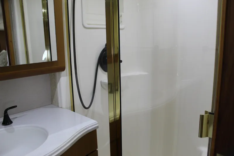 Slide: The Image of Bathroom interior of 2003 Ocean Yachts 65 Odyssey with shower and vanity. - 76