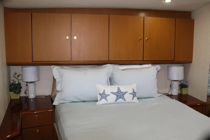 Slide: The Image of Luxurious bedroom interior of 2003 Ocean Yachts 65 Odyssey with starfish-themed decor. - 83
