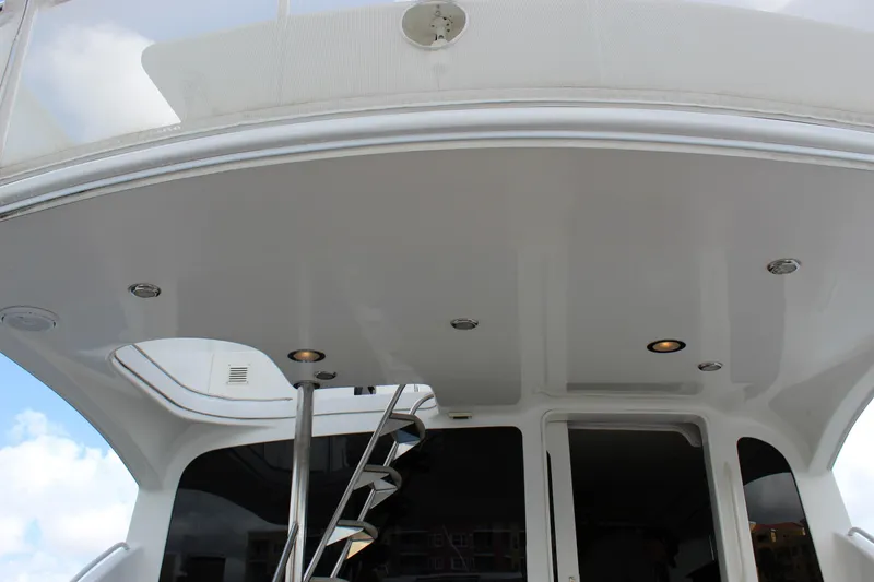 Slide: The Image of 2003 Ocean Yachts 65 Odyssey yacht interior with spiral staircase and modern lighting. - 88