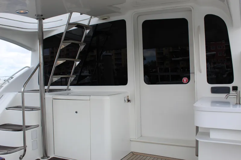 Slide: The Image of 2003 Ocean Yachts 65 Odyssey yacht deck with stairs and sink. - 92