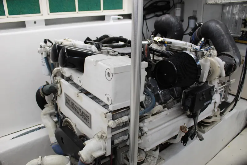 Slide: The Image of Engine room of 2003 Ocean Yachts 65 Odyssey, featuring a powerful marine engine. - 97