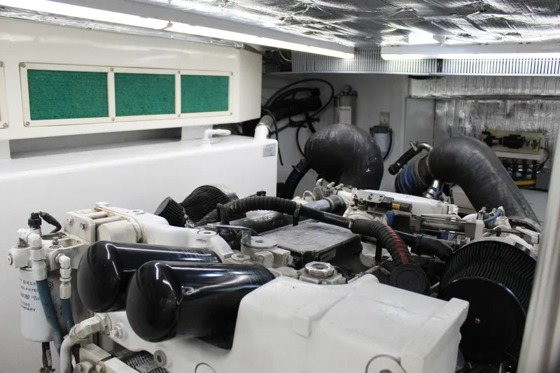 Slide: The Image of Engine room of 2003 Ocean Yachts 65 Odyssey, showcasing mechanical components and systems. - 99