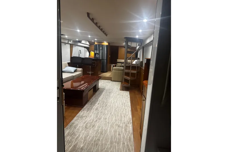 Slide: The Image of Luxurious interior of 2003 Ocean Yachts 65 Odyssey, featuring elegant seating and modern amenities. - 23