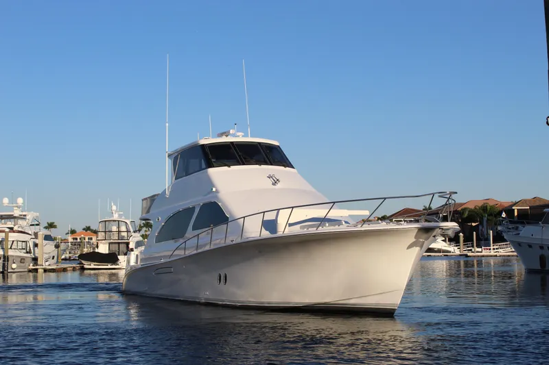Slide: The Image of 2003 Ocean Yachts 65 Odyssey in marina, clear sky, calm waters. - 3