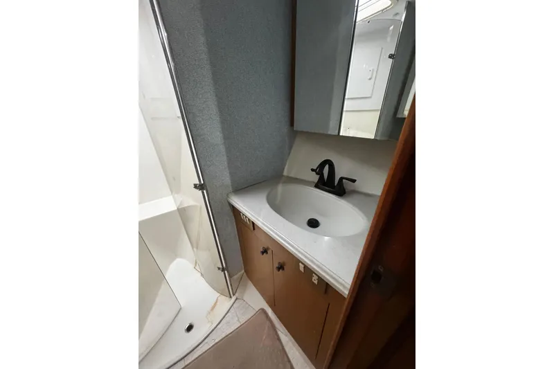 Slide: The Image of Bathroom interior of 2003 Ocean Yachts 65 Odyssey with sink and shower. - 35