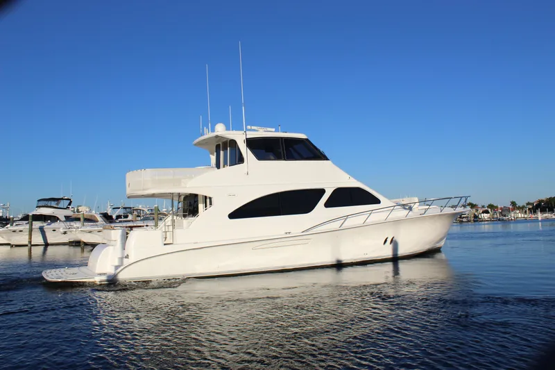 Slide: The Image of 2003 Ocean Yachts 65 Odyssey cruising in a marina under clear blue skies. - 5
