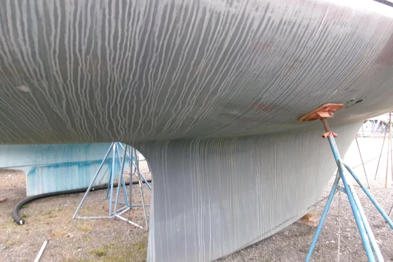 Slide: The Image of Bottom view of a 1980 Ketch 51 sailboat hull on stands. - 7