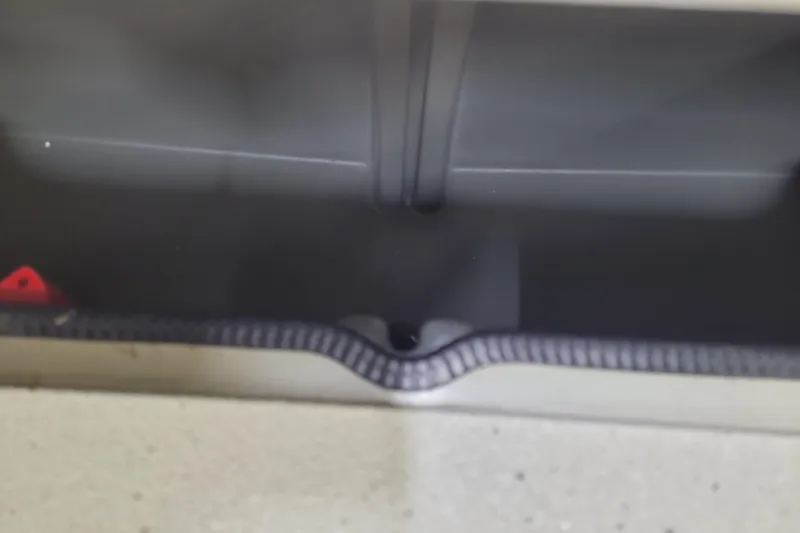 Slide: The Image of Interior view of 2024 Ranger RB210 storage compartment. - 18