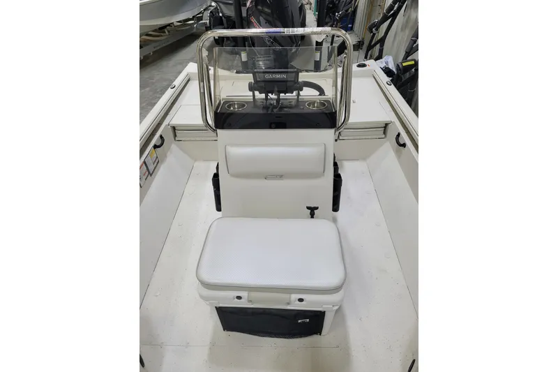 Slide: The Image of 2024 Ranger RB210 boat interior with white seating and Garmin equipment. - 21