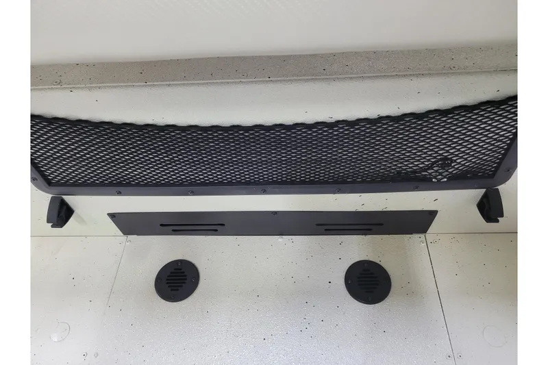 Slide: The Image of 2024 Ranger RB210 interior with black mesh storage and drainage vents. - 22