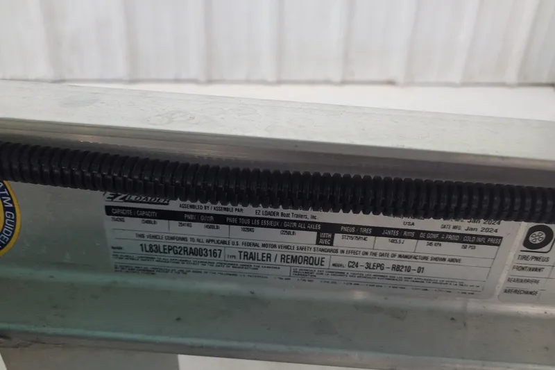 Slide: The Image of Label on 2024 Ranger RB210 trailer, showing specifications and compliance details. - 26