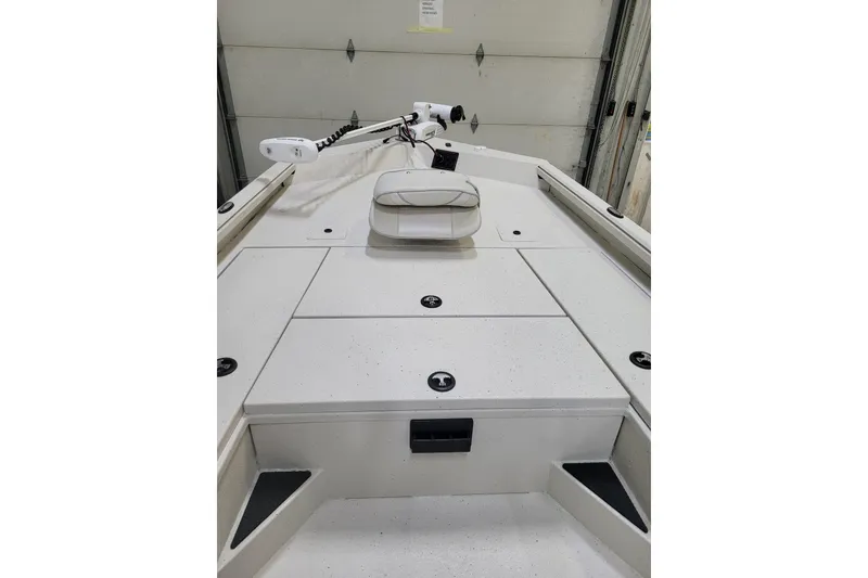 Slide: The Image of 2024 Ranger RB210 boat interior with white deck and mounted equipment. - 3