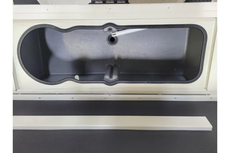 Slide: The Image of 2024 Ranger RB210 boat storage compartment, open and empty, with a sleek design. - 5