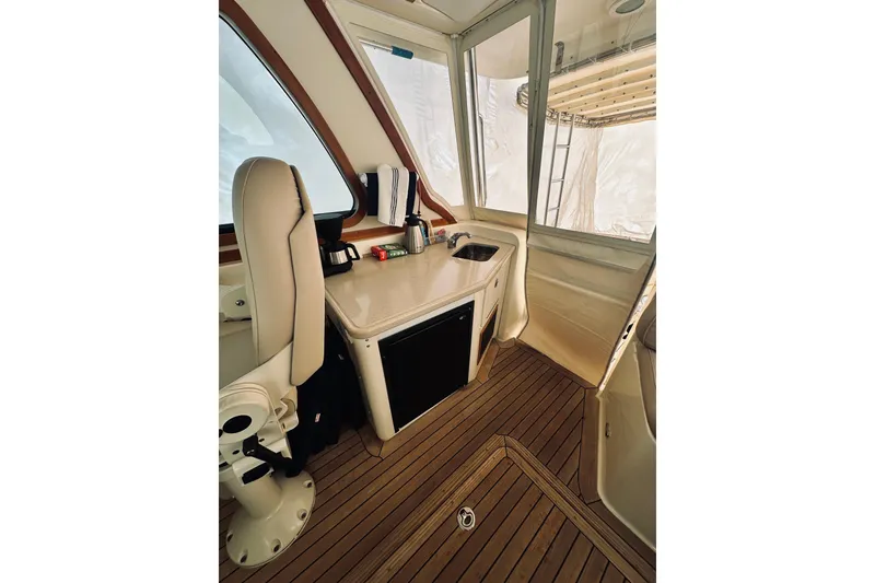 Slide: The Image of Captain's chair in 2008 Sabre 38 Hard Top Express yacht interior. - 11