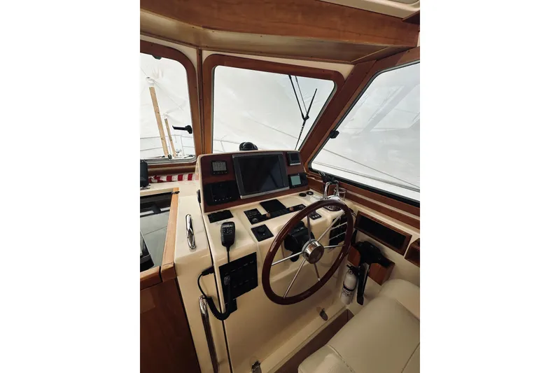 Slide: The Image of Luxurious helm seat in 2008 Sabre 38 Hard Top Express yacht interior. - 13
