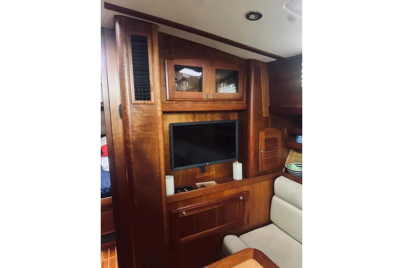 Slide: The Image of 2008 Sabre 38 Hard Top Express helm with Garmin navigation system and wooden accents. - 23