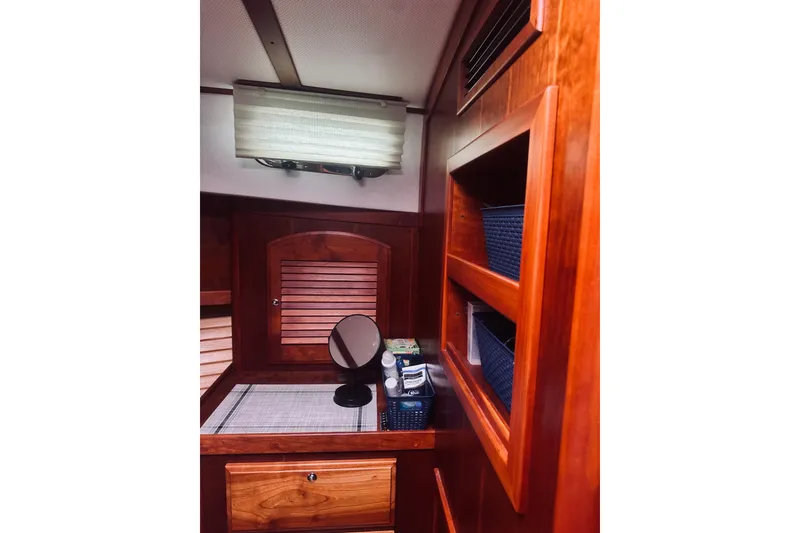 Slide: The Image of 2008 Sabre 38 Hard Top Express interior with wood finish and cozy seating area. - 26