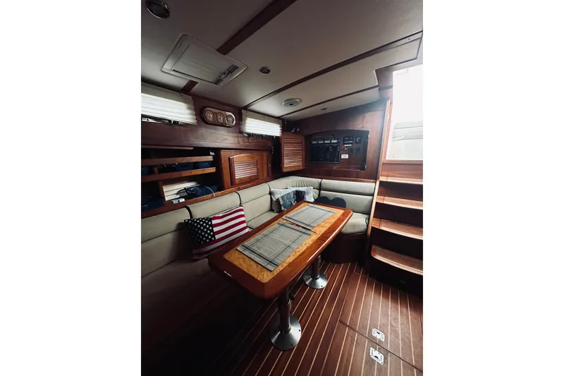 Slide: The Image of Interior of 2008 Sabre 38 Hard Top Express with wooden cabinetry and storage shelves. - 30