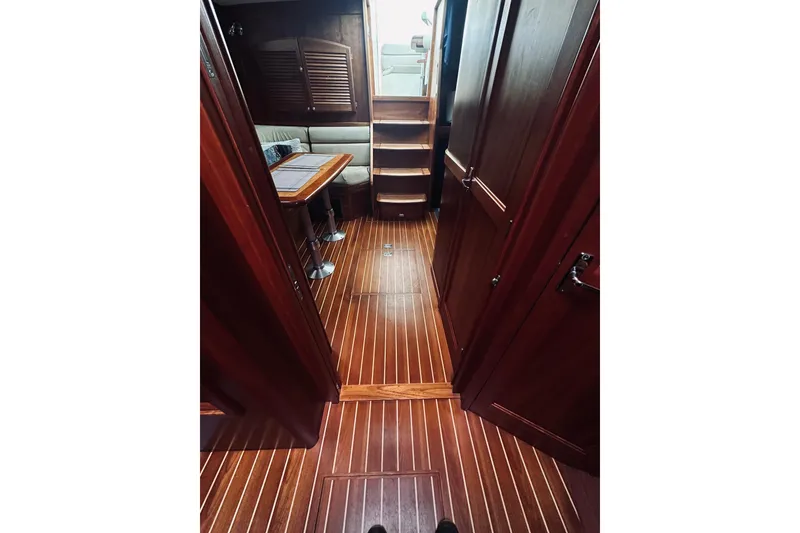 Slide: The Image of Cozy cabin interior of 2008 Sabre 38 Hard Top Express with colorful bedding. - 47