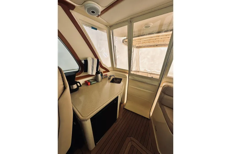 Slide: The Image of 2008 Sabre 38 Hard Top Express boat interior with American flag and ocean view. - 5