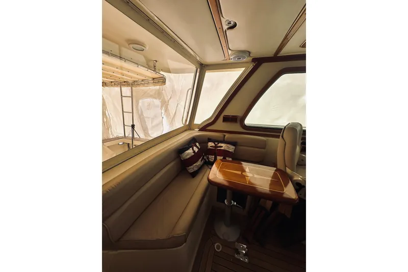 Slide: The Image of 2008 Sabre 38 Hard Top Express interior with ladder and covered seating area. - 6