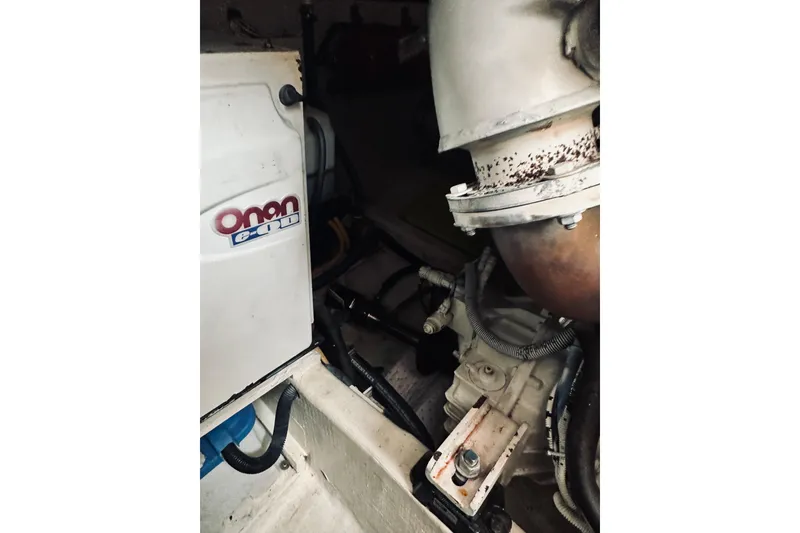 Slide: The Image of Engine compartment of 2008 Sabre 38 Hard Top Express boat, featuring a filter system. - 63