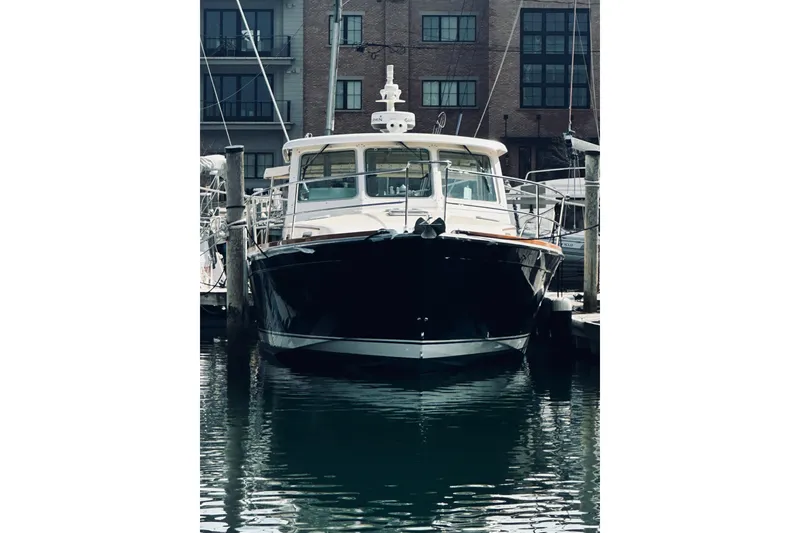 Slide: The Image of 2008 Sabre 38 Hard Top Express yacht docked in marina, front view. - 78