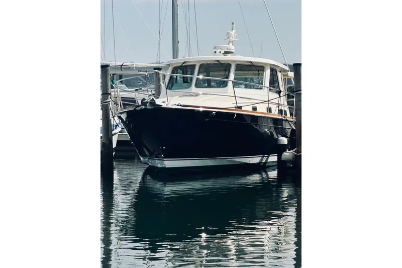 Slide: The Image of 2008 Sabre 38 Hard Top Express yacht docked in marina, front view. - 79