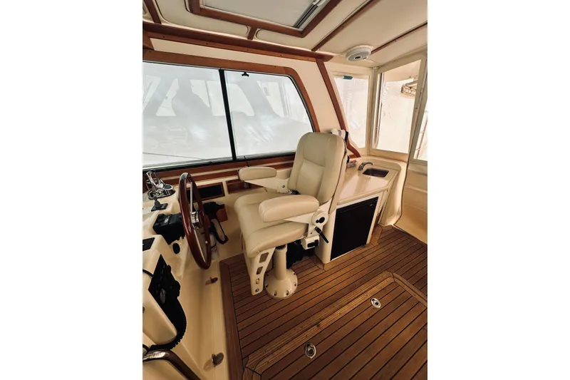 Slide: The Image of Interior of 2008 Sabre 38 Hard Top Express yacht with seating and table. - 9