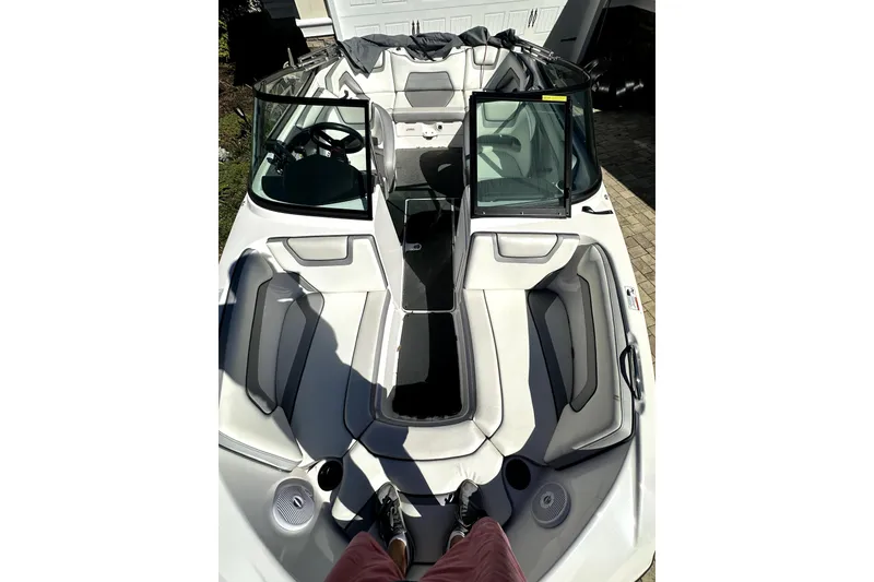 Slide: The Image of 2017 Yamaha Boats SX190 interior view with open windshield and seating area. - 2
