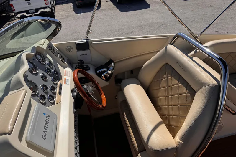 Slide: The Image of 2019 Chris-Craft Corsair 30 cockpit with Garmin navigation and luxurious leather seating. - 13