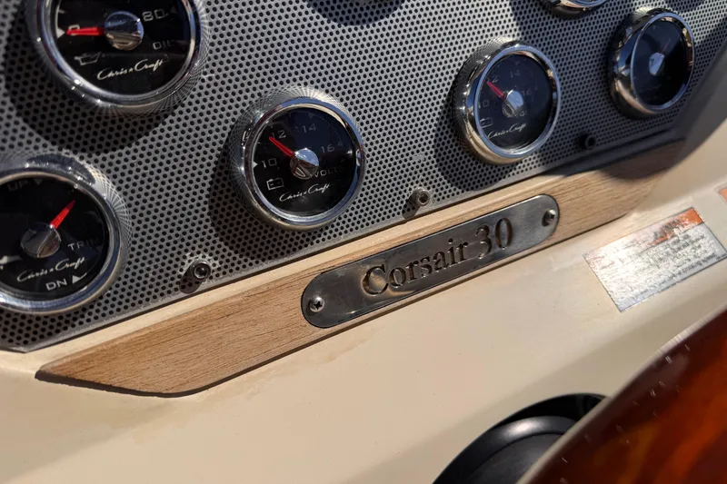 Slide: The Image of Dashboard of 2019 Chris-Craft Corsair 30 with gauges and model nameplate. - 19